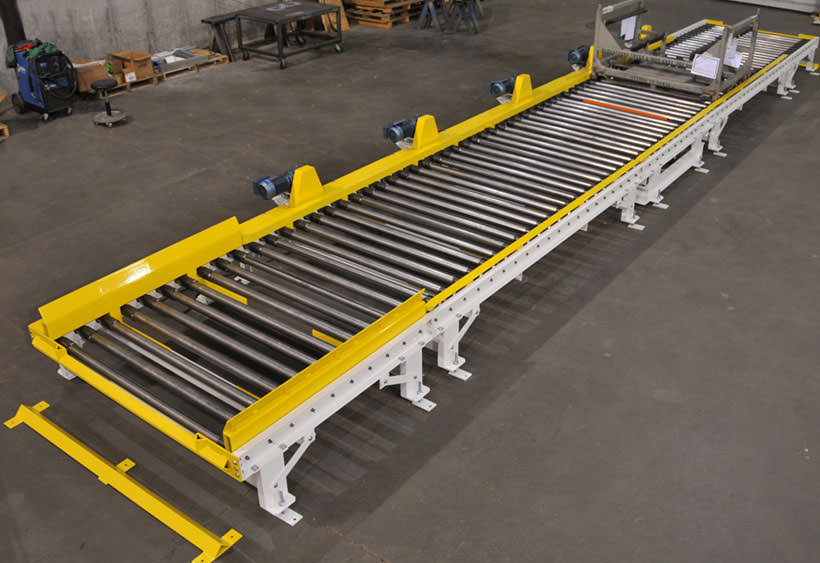 CDLR conveyor with blade stop and rack locator pins